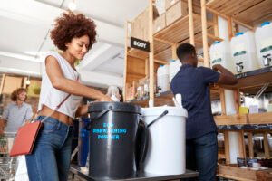 Shoppers Buying Home And Body Products In Sustainable Plastic Free Grocery Store