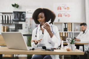 Qualified doctor making online consultation for patient